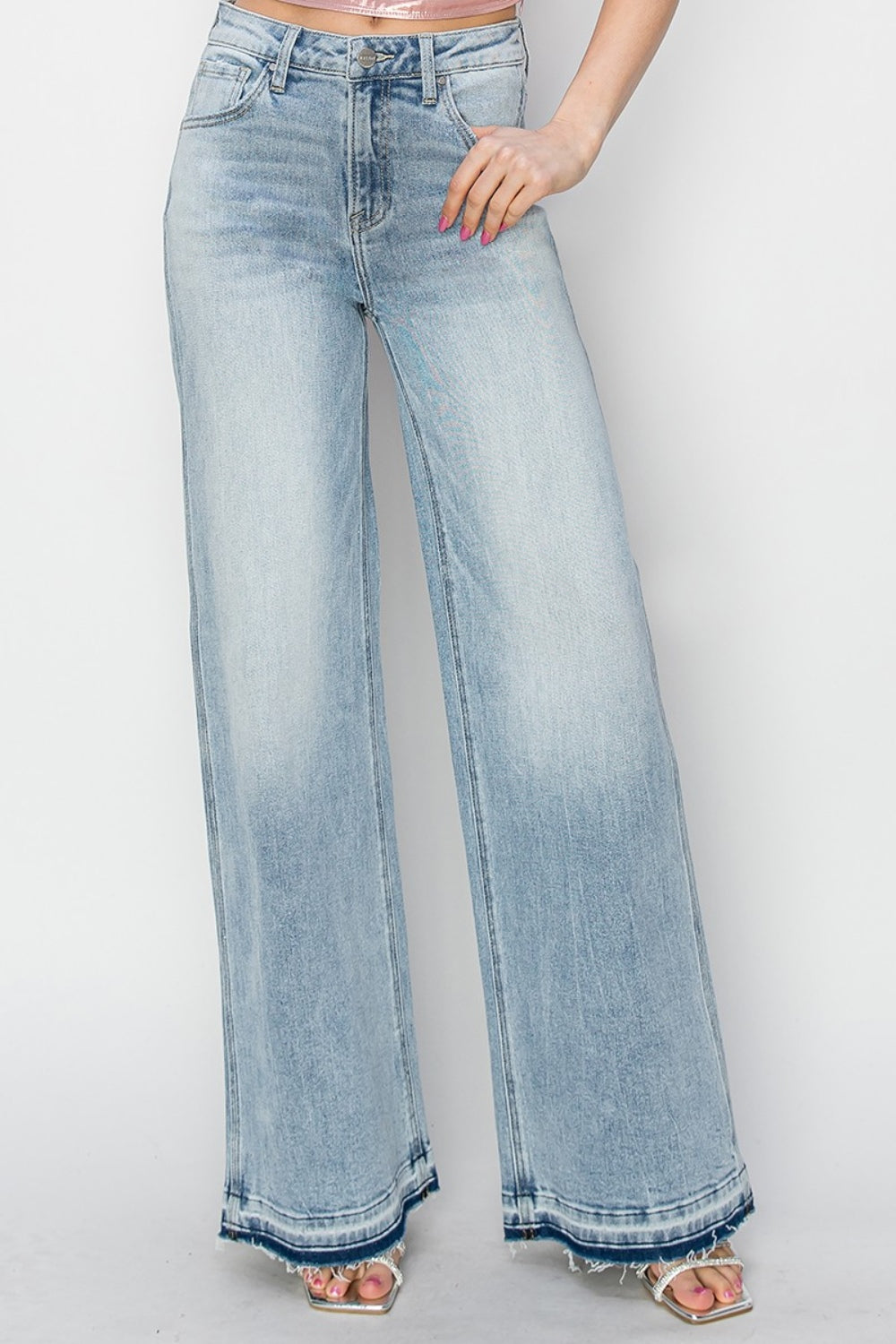 Risen High Rise Wide Leg Release Hem Light Wash Jeans