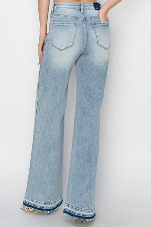 Risen High Rise Wide Leg Release Hem Light Wash Jeans